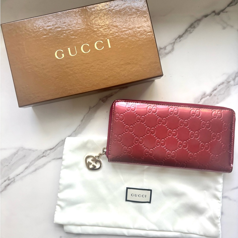 Gucci Guccissima patent leather zip-around long wallet with a heart charm detail